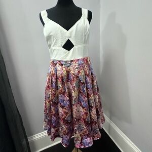 Dress with a cross-back and cut out details.  Perfect wedding guest dress.